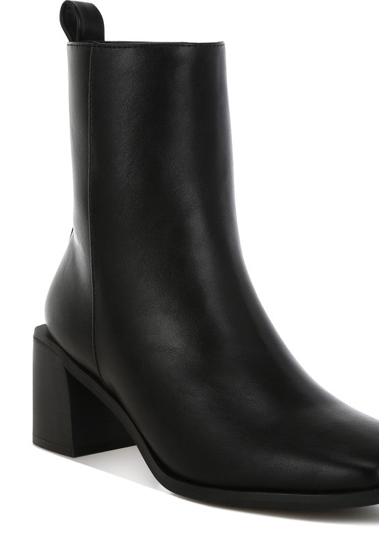 Close-up of Black Muskox Square Toe Boots showing vegan leather texture.