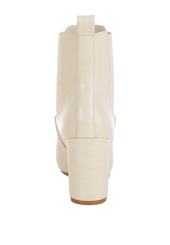 Back view of beige Briony Block Heel Ankle Boots showing pull tab and patent finish.