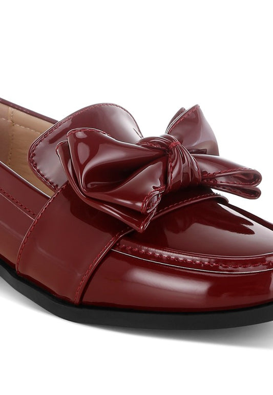 Close up of Araminta Classic Chunky Bow Loafers in Burgundy showing chunky bow and stitching detail
