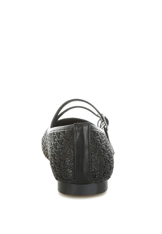 Back view of Warena Ballerinas in black, flat heel with raffia and faux leather finish