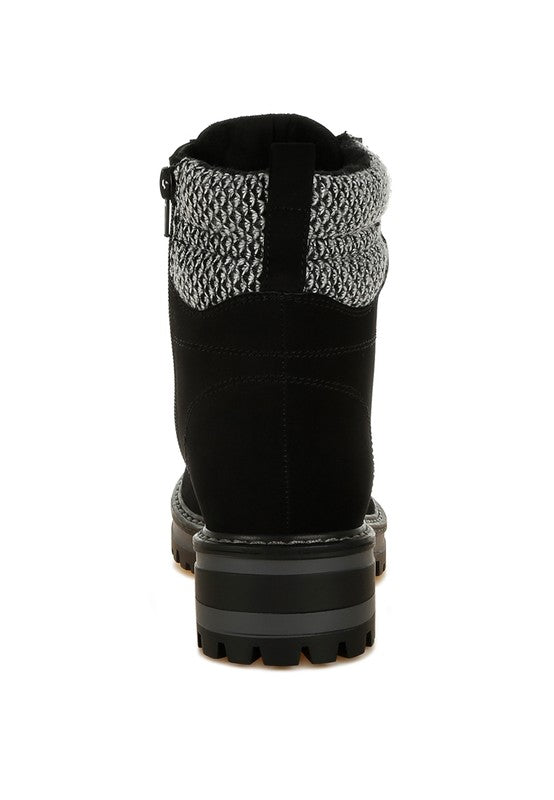 Back view of Black Mahisha Hiker Boots with functional zipper closure and stacked heel.