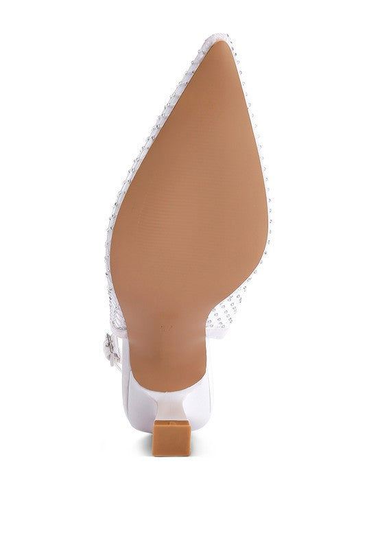 Bottom view of white rhinestone pointed-toe slingback mules.