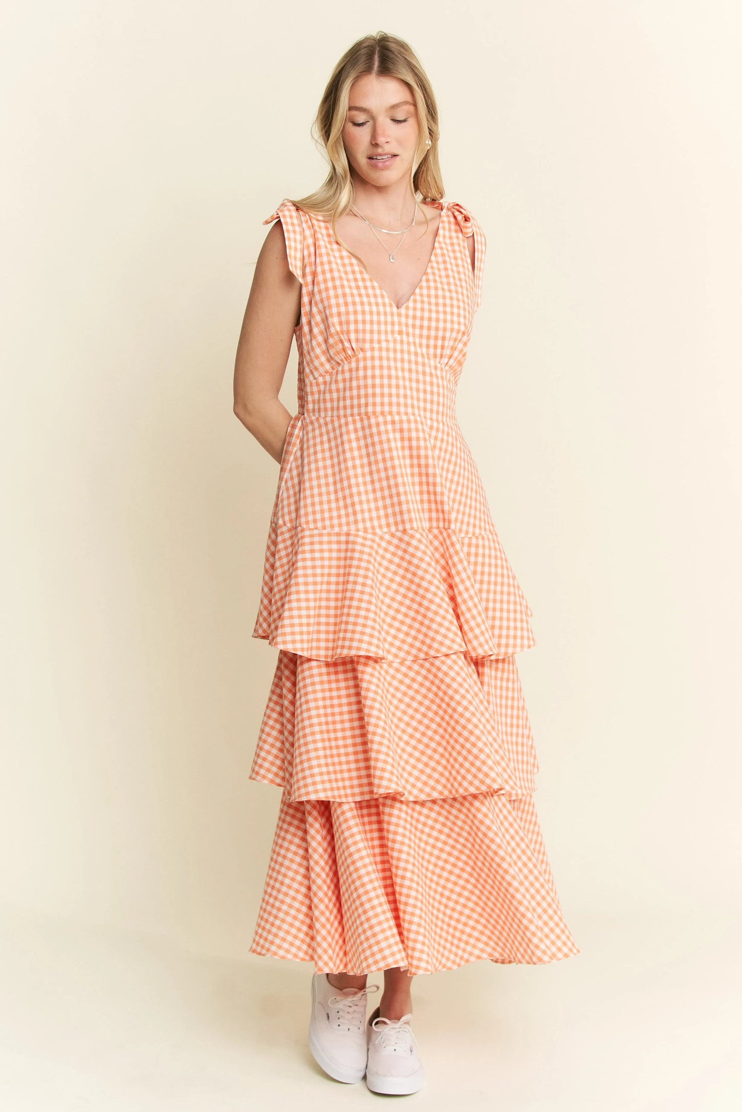 Full body front view of Alice Gingham Tiered Midi Dress by Jade by Jane, showcasing all three ruffled tiers, halter neckline, and orange gingham print.