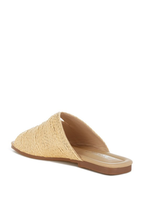 Back inside view of beige Daisy Doe raffia flat highlighting the textured raffia material and slip-on design.
