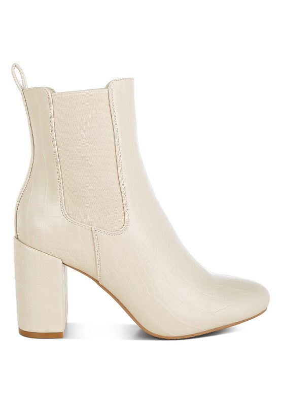 Side view of beige Briony Block Heel Ankle Boots with thick heel and pull tab.