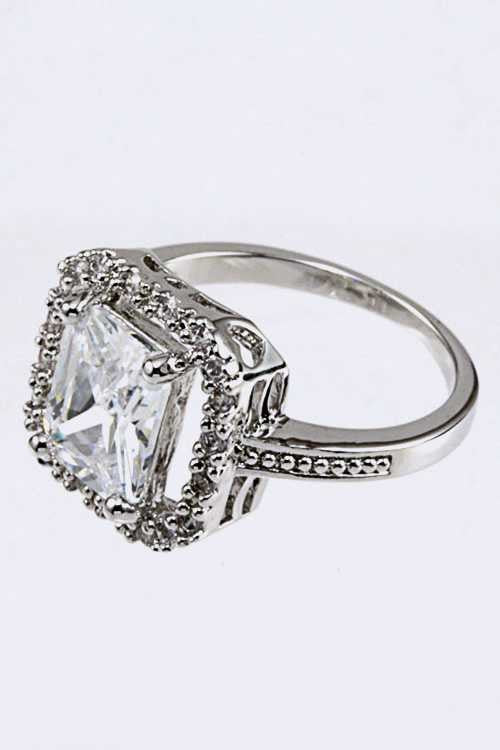 Side angle view of Elegant Cubic Zirconia Ring with cubic zirconia stones set in sleek rhodium-plated brass band.