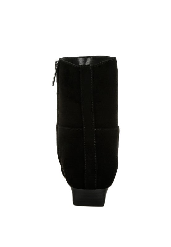 Back view of the black Hakra suede boot showcasing the flared low heel and sleek paneling detail.
