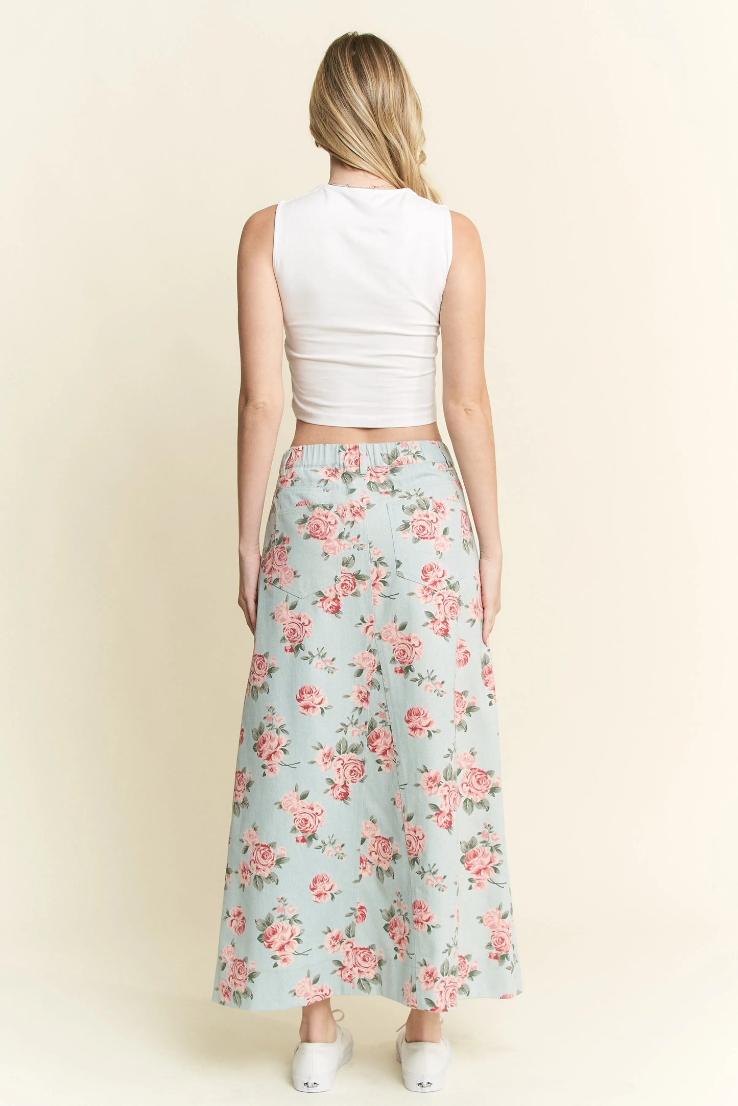 Back view of light blue denim skirt with floral print, maxi length, and pockets – available in plus sizes for inclusive fashion.