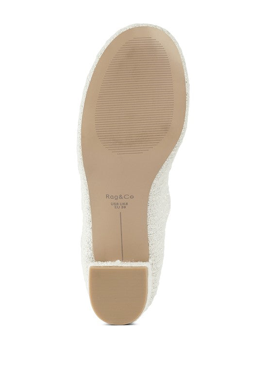 Bottom view of White Antara Tweed Mary Jane Heels showing durable rubber sole and heel design.