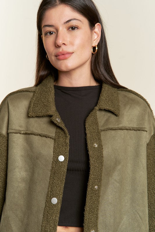Close-up of olive Galina Curvy Plus Faux Suede Jacket showing plush sherpa details.
