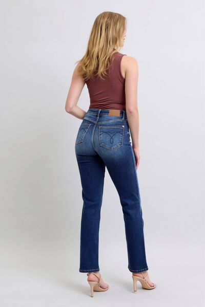 Full body back view of Carson Straight Leg Jeans with dark wash, straight leg cut, and pocket detail.
