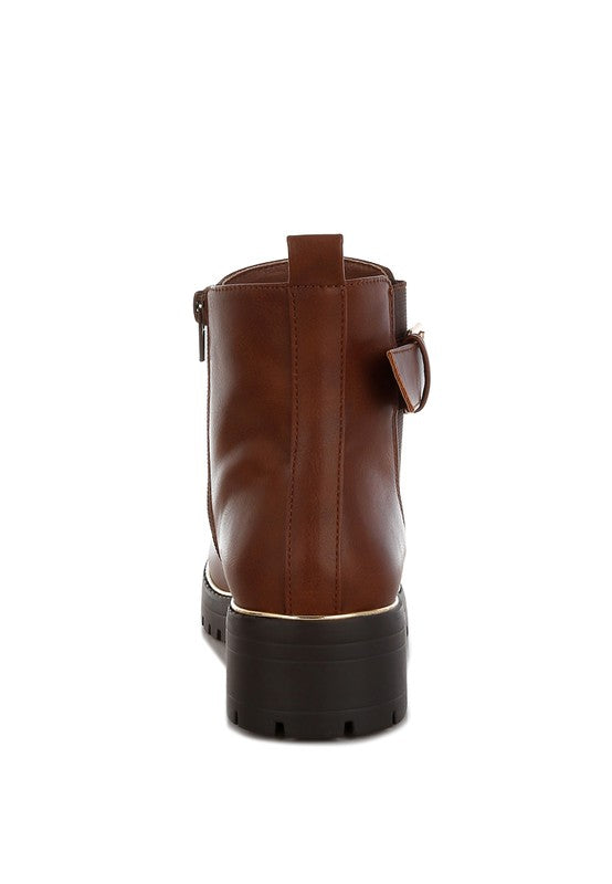 Back view of tan Antorin chunky buckle ankle boots with pull tabs and seam detail.