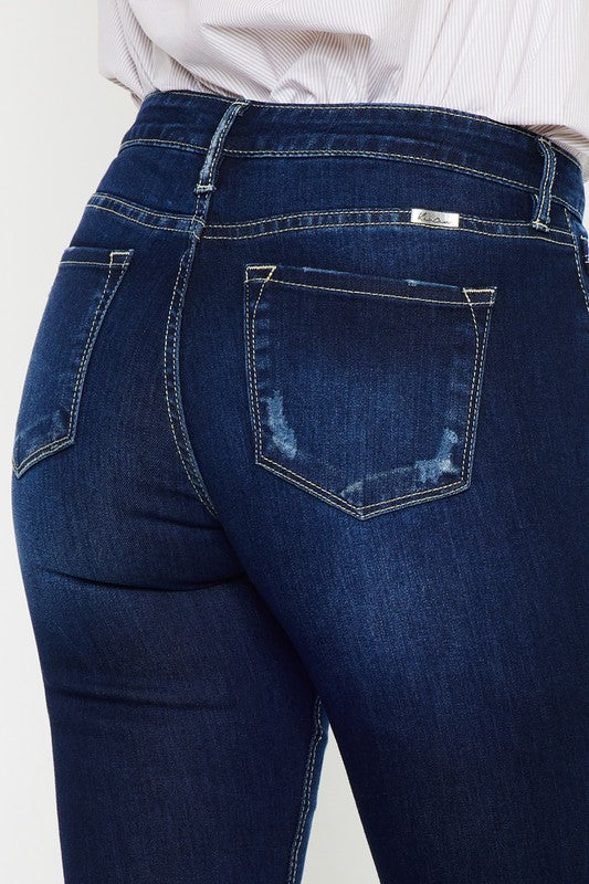 Close-up back view showing KanCan branding label and stitched back pockets on Hester Flare Jeans.