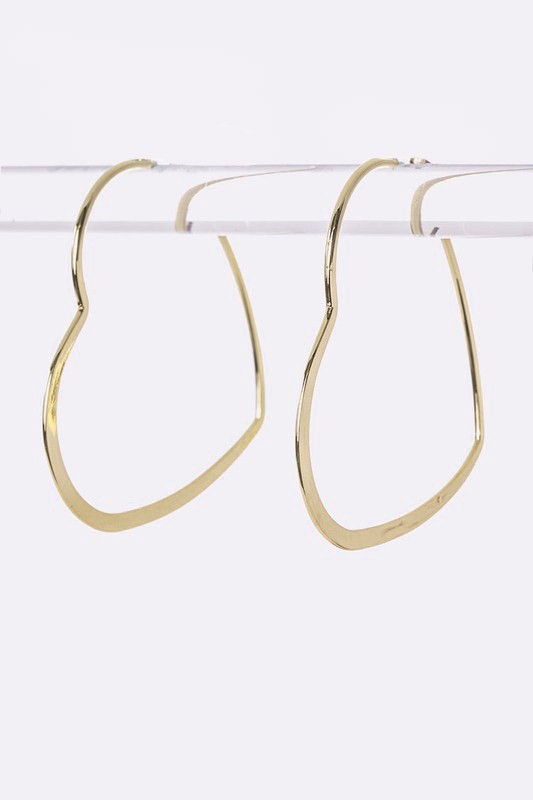 Gold Libby Heart Hoops – Oversized gold heart-shaped hoop earrings with a bold, statement-making design.