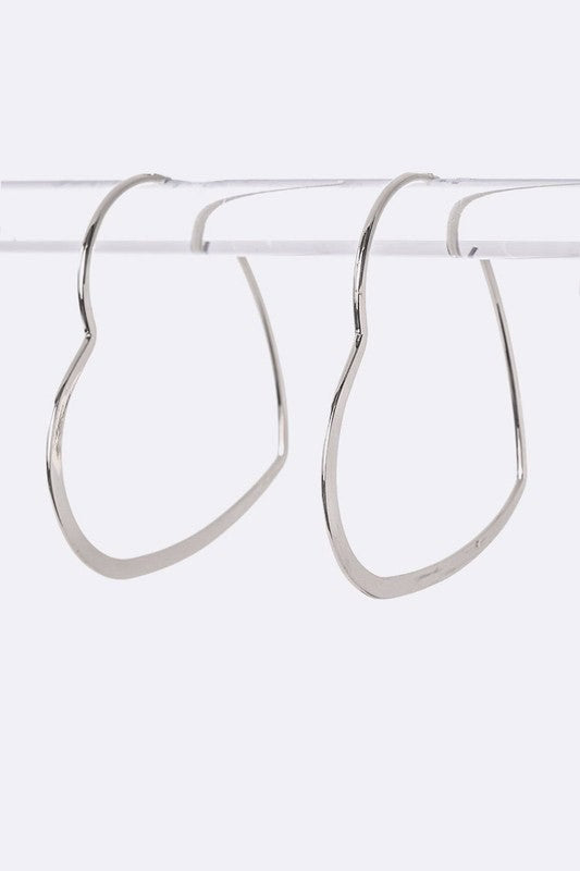 Silver Libby Heart Hoops – Oversized silver heart-shaped hoop earrings with a bold, statement-making design.
