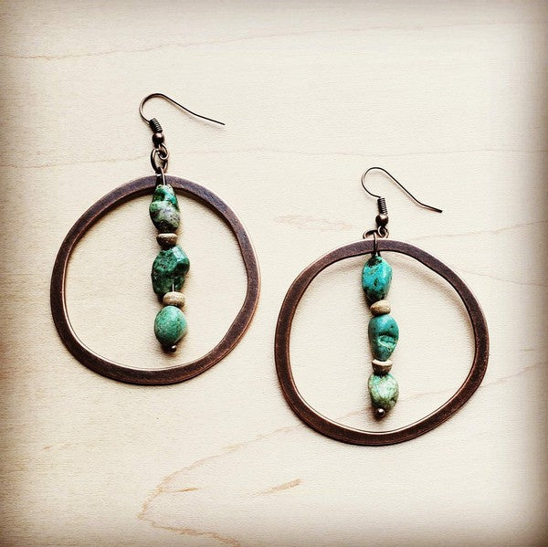Flat lay of Copper Hoop Earrings with natural turquoise chunks and wood accents, handcrafted boho-chic design.