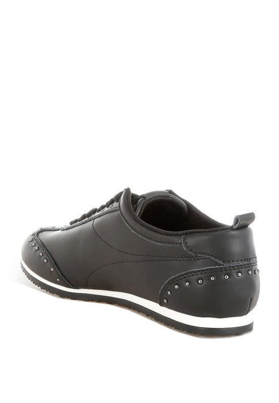 Black Odaya Studded Leather Sneakers by Rag Company, back inside angle view highlighting heel, pull tab, and stud detailing.
