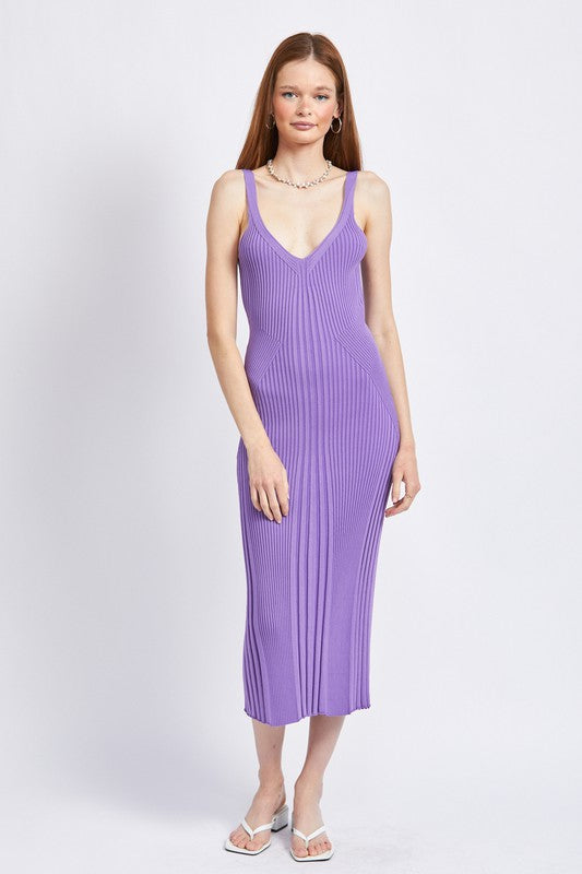 Woman wearing lavender midi dress with open back and sleek, curve-hugging fit.