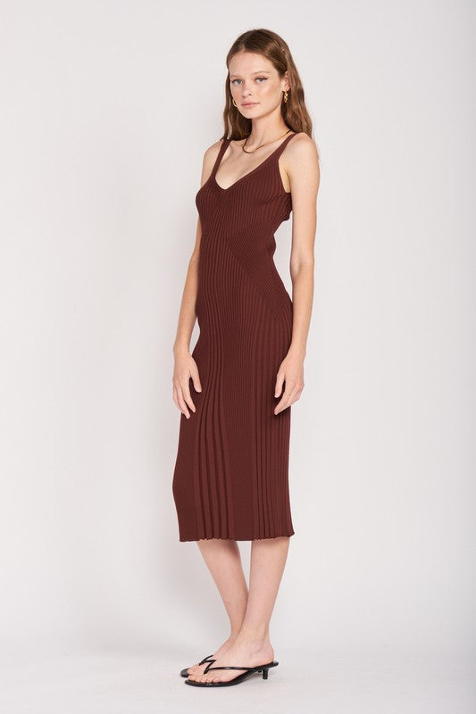 Side profile of chocolate V-neck ribbed midi dress with bodycon silhouette.
