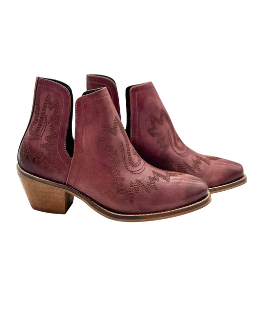 Burgandy leather booties with Western embroidery, roomy snip toe, cushioned footbed, and ankle slits.