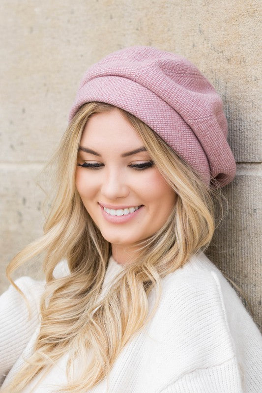 Woman wearing mauve Celine Fold Over Beret styled with fold over design and relaxed fit.