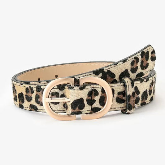 Rolled leopard print D-ring belt highlighting gold buckle and smooth vegan leather texture.