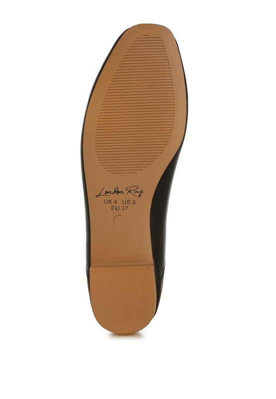Sole view of vegan leather ballerina, showing textured grip outsole for traction, flat heel, and durable construction for all-day wear.