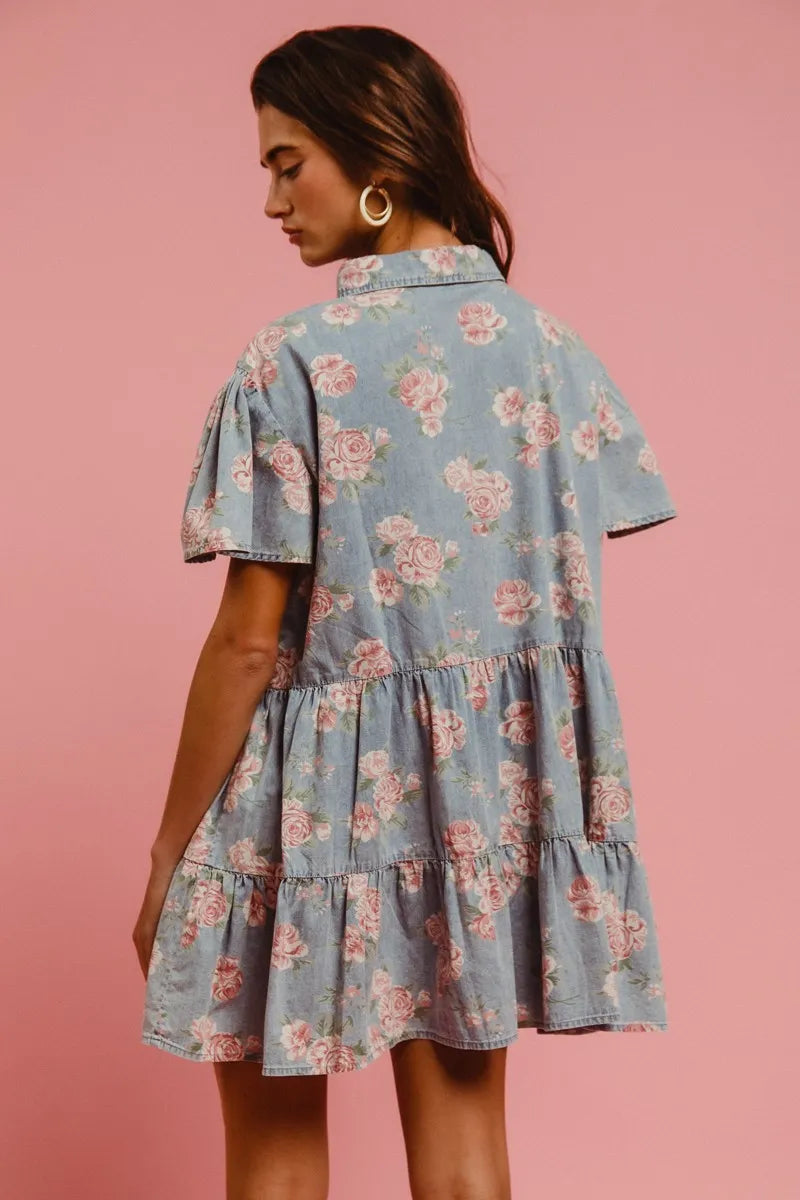 Back view of Isla Floral Tiered Shirt Dress with soft denim blue base, pink floral print, and flowing mini length.