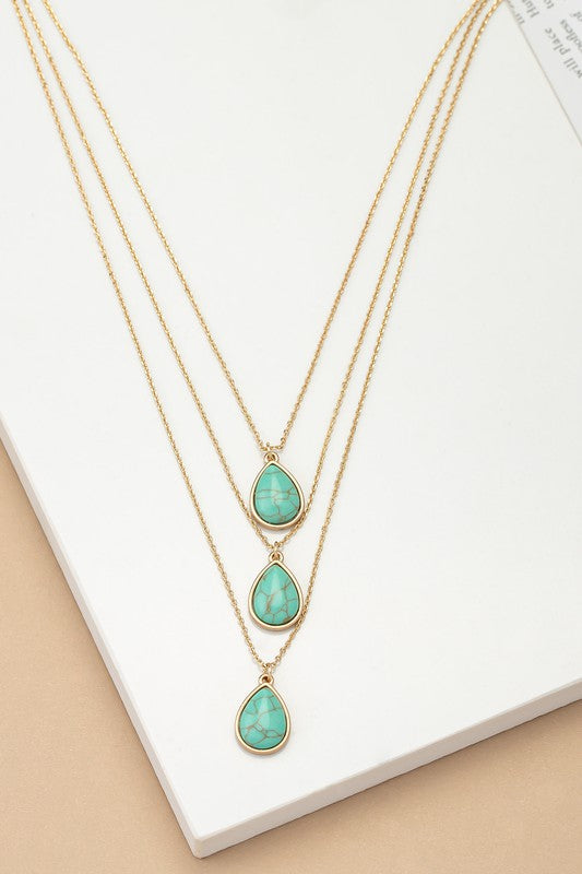 orina Three Layer Teardrop Stone Pendant Necklace in turquoise with layered chains and small teardrop stone pendant.