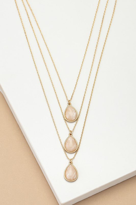 Torina Three Layer Teardrop Stone Pendant Necklace in soft pink with layered chains and small teardrop stone pendant.