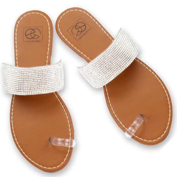 Top view of Kylie Rhinestone Toe Ring Sandals highlighting clear straps, silver rhinestones, and flat sole.