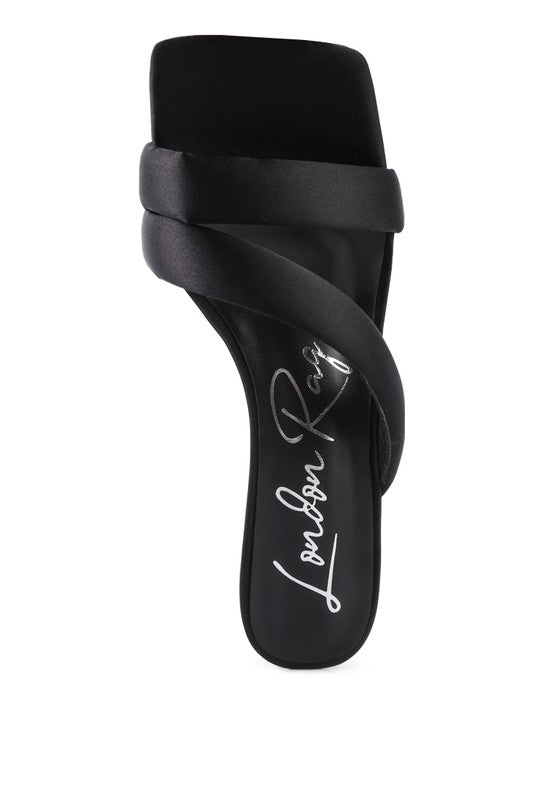 Top view showing black satin cross strap and square toe detail