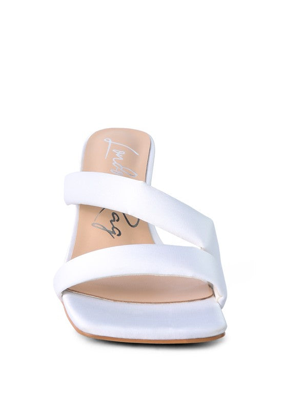 Front view showing off white satin cross strap and square open toe