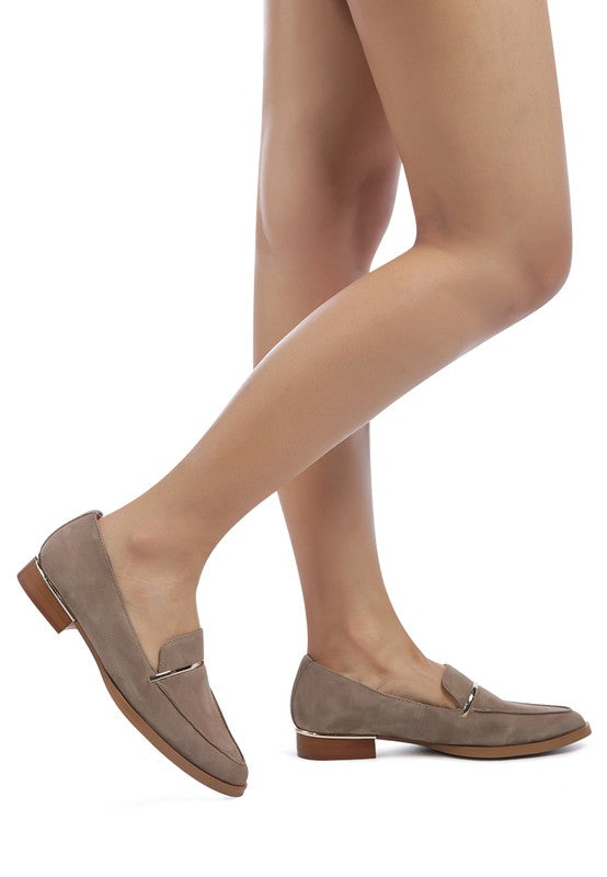 Woman modeling Taupe Paulina Suede Leather Loafers showing metallic heel accent and suede texture.
