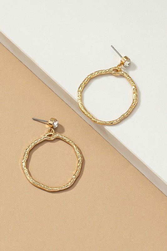 Pair of Hammered Hoop Drop Earrings side by side on a flat surface, showcasing hammered gold hoops and rhinestone stud detail.