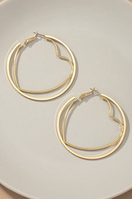 Pair of Circle & Heart Hoop Earrings in shiny gold, featuring heart-shaped hoops nested inside larger circular hoops.
