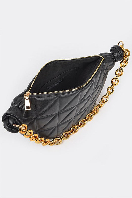 Inside view of black Mona Quilted Shoulder Bag showing spacious compartment and lining.