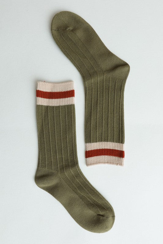Flat lay of green Simone Color Block Socks showing ribbed cuff