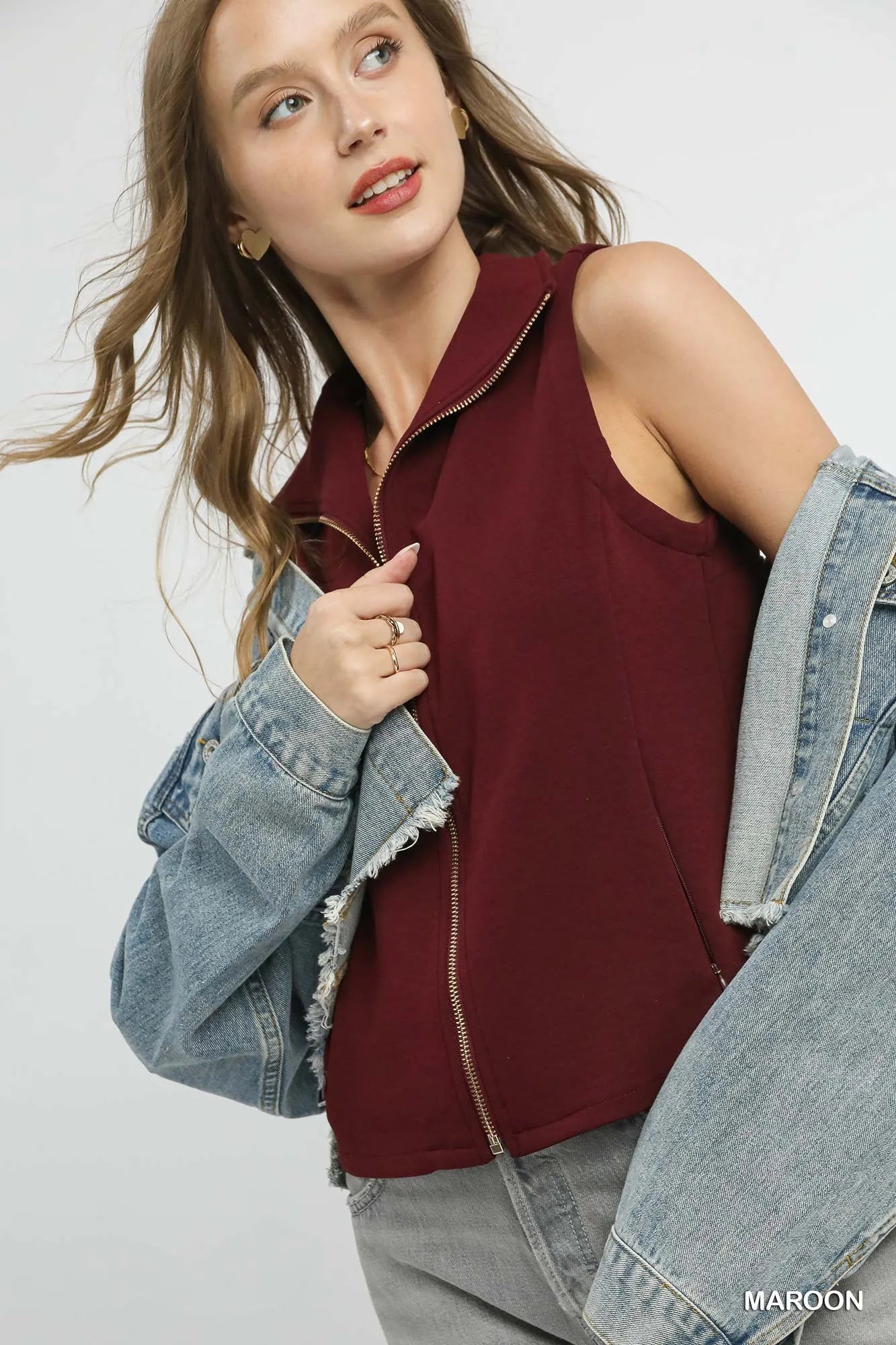 Front view of Zahra Zip-Front Fitted Vest showing maroon color, zip-front, and functional pockets.