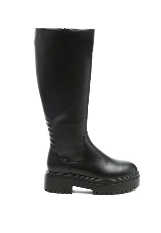 Black platform knee-high boots with a round toe, crafted from vegan leather. Featuring a zipper closure for easy wear, a 2" heel, and a durable TPR sole.