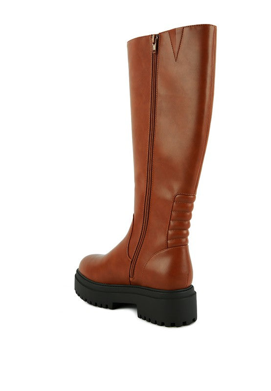 Tan platform knee-high boots with a round toe, crafted from vegan leather. Featuring a zipper closure for easy wear, a 2" heel, and a durable TPR sole.