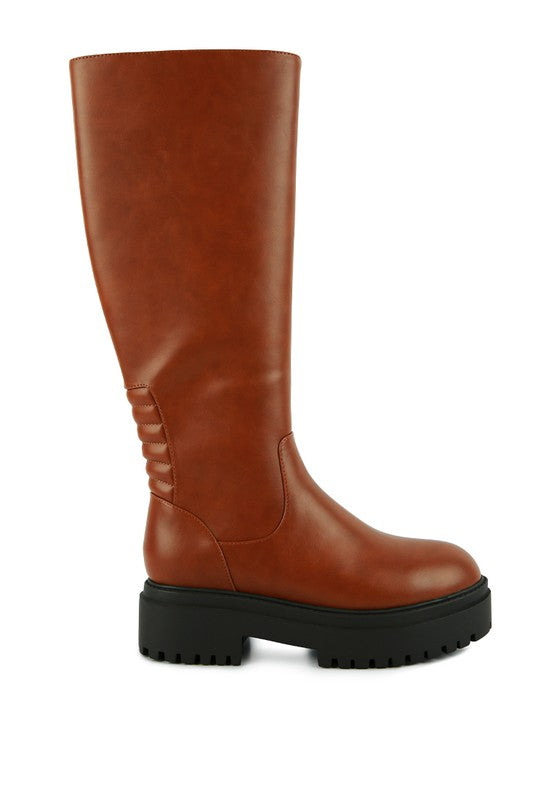 Tan platform knee-high boots with a round toe, crafted from vegan leather. Featuring a zipper closure for easy wear, a 2" heel, and a durable TPR sole.