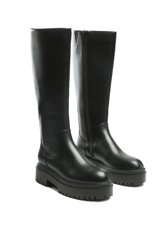 Black platform knee-high boots with a round toe, crafted from vegan leather. Featuring a zipper closure for easy wear, a 2" heel, and a durable TPR sole.
