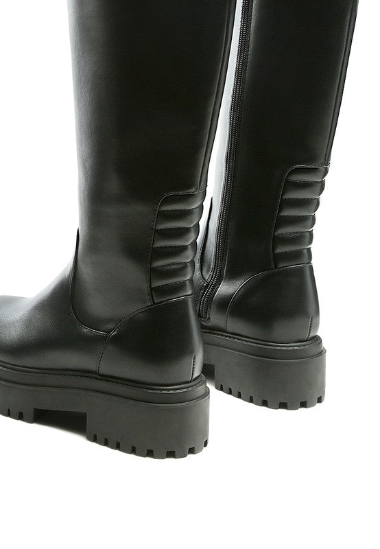 Black platform knee-high boots with a round toe, crafted from vegan leather. Featuring a zipper closure for easy wear, a 2" heel, and a durable TPR sole.