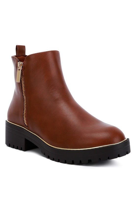 Front angle view of Tan Thorin Block Heel Boots with metallic zipper closure and lug sole.