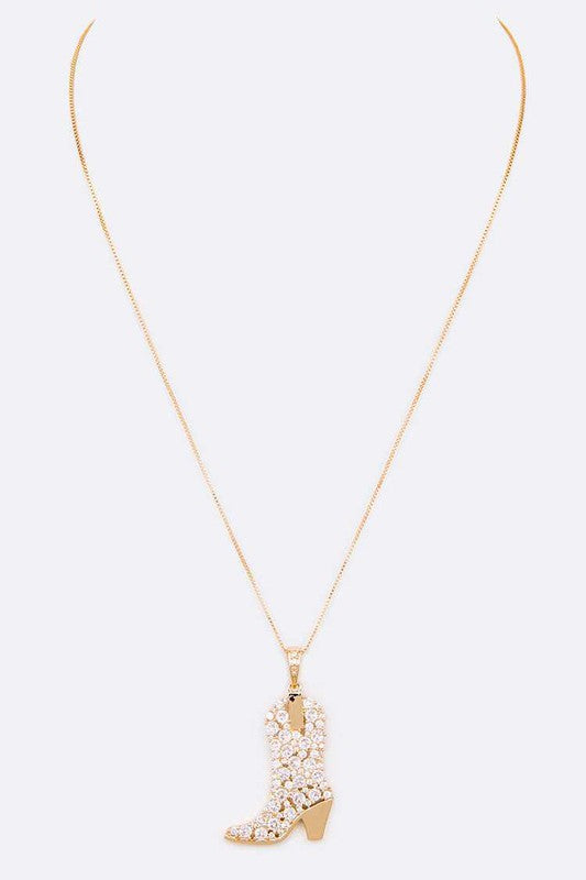 Sadie Cowboy Boot Pendant Necklace in gold, shown with long adjustable chain and detailed boot charm.
