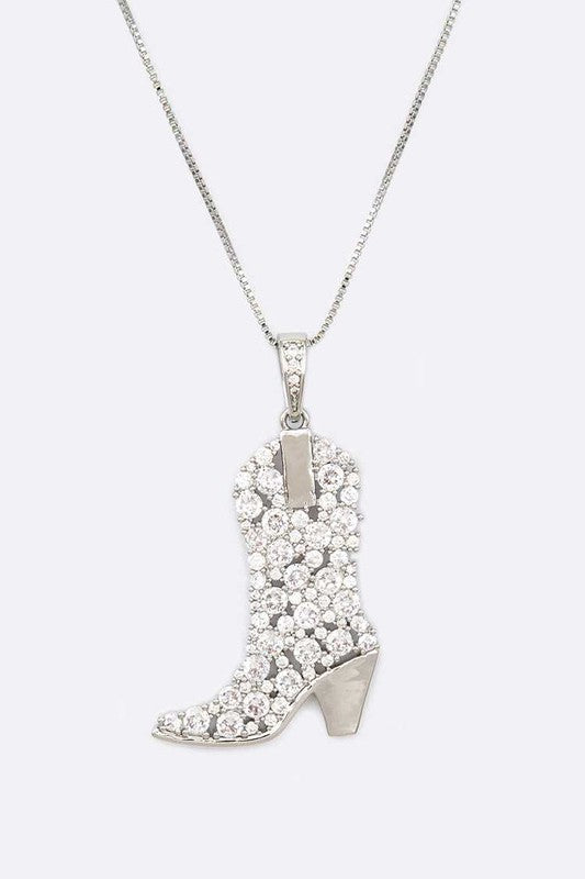 Close-up of Sadie Cowboy Boot Pendant Necklace in rhodium finish, detailed with sparkling cubic zirconia.