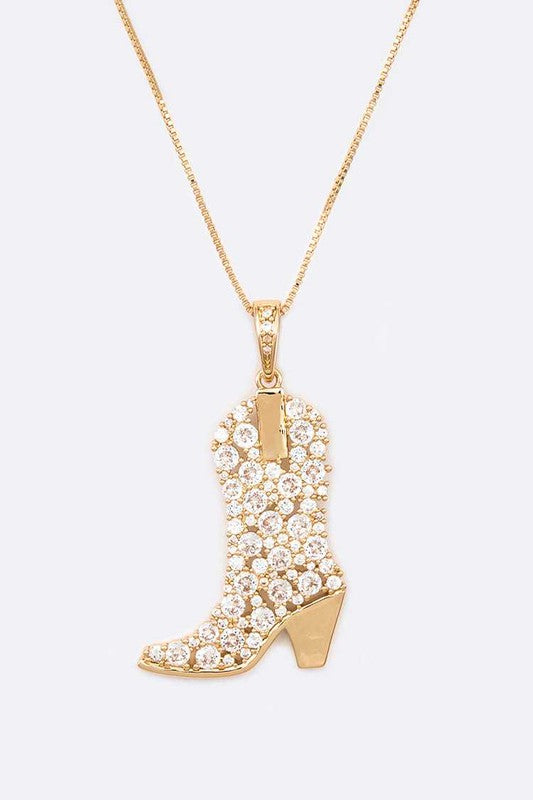 Close-up of Sadie Cowboy Boot Pendant Necklace in gold with shimmering cubic zirconia stones.