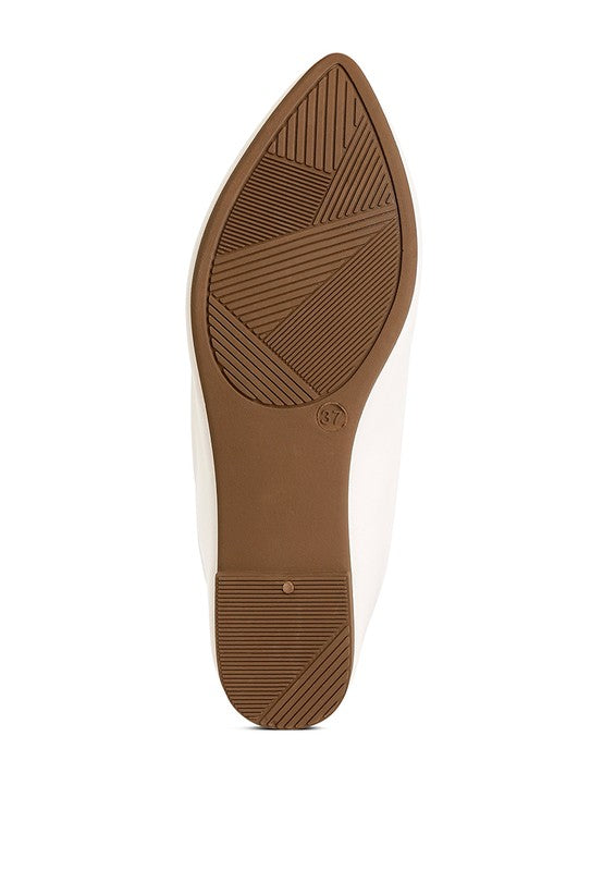 Bottom sole view of white ballet flats with flat outsole