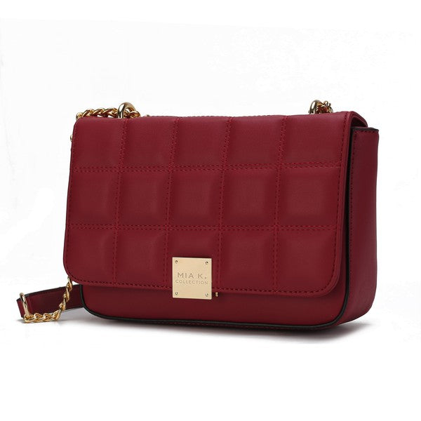 Red Nyra Quilted Shoulder Bag with gold-tone flip lock and adjustable shoulder strap.